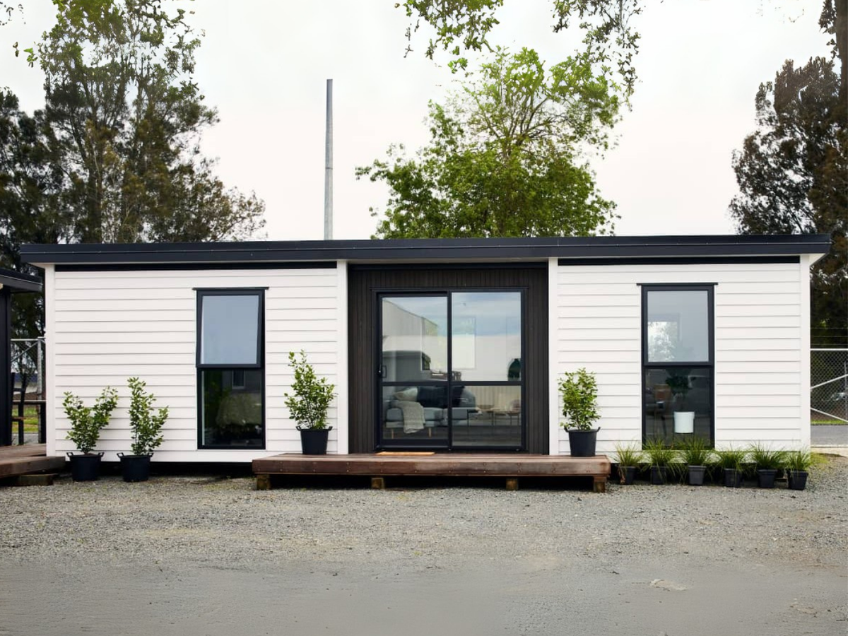 A Tiny Home Base transportable home placed on a rural site